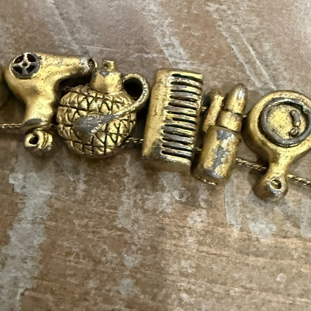 Vintage Hair and Makeup Gold Tone Charm Bracelet
